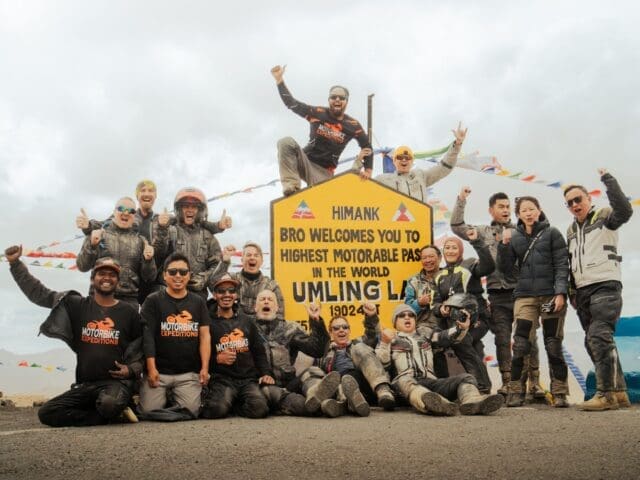 Group of motorbike riders from Motorbike Expedition reaching the highest motorable pass in the world, Umling La Pass.